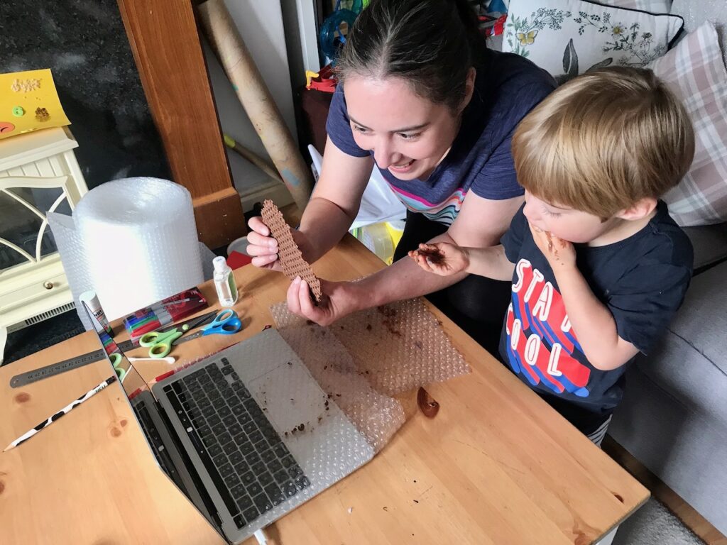 Becky and Reuben showing their bubble chocolate to the group video