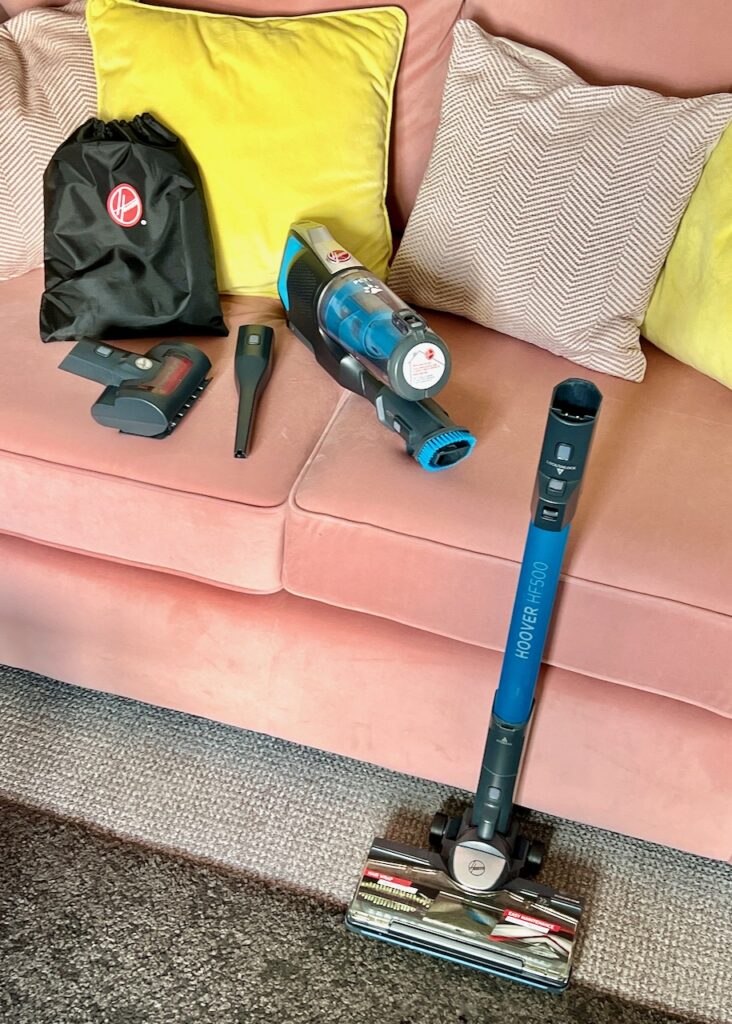 The Hoover Anti-Twist contents displayed as handheld cleaner, separated stick and floorhead, and additional tools.